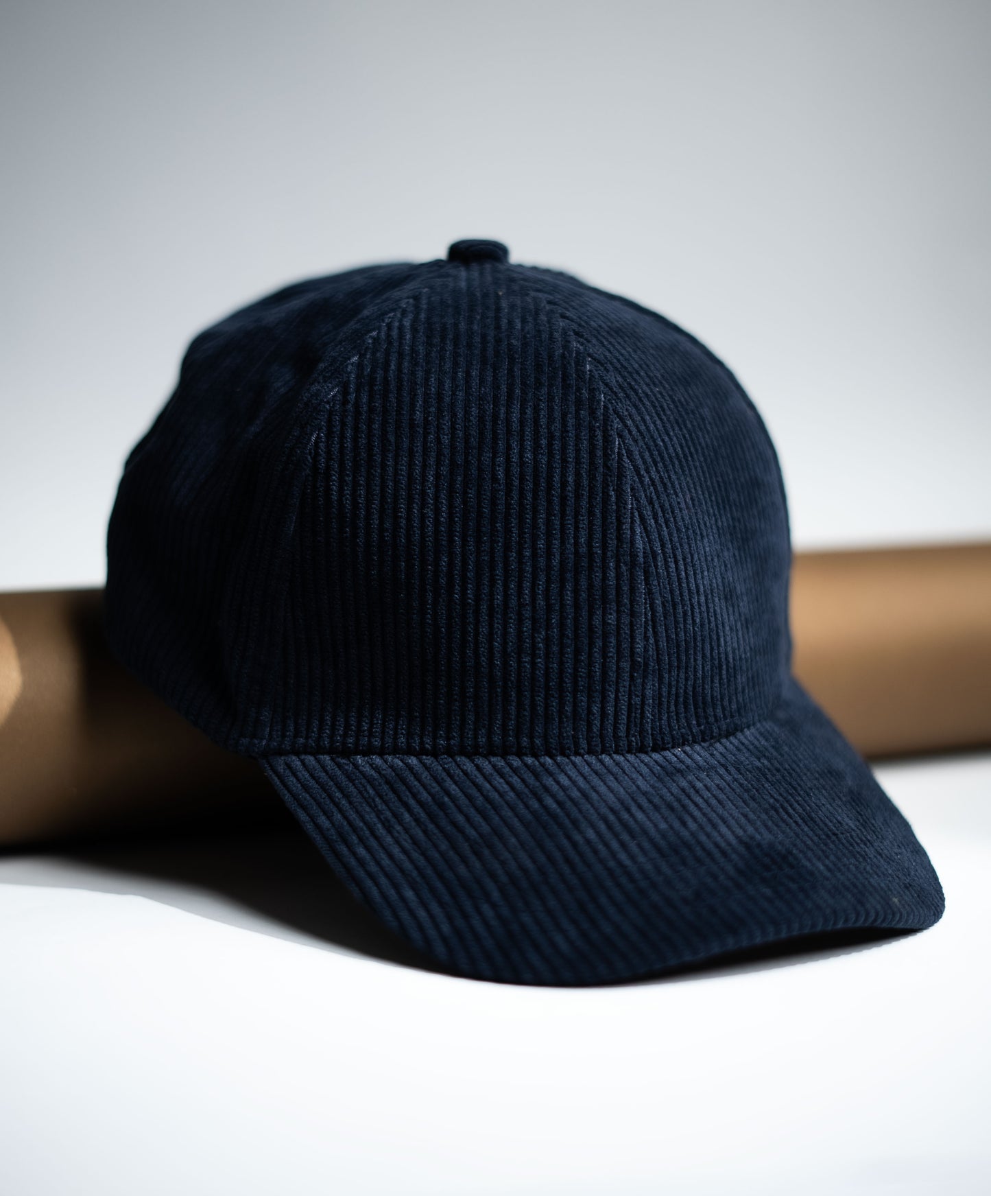 Navy blue corduroy cap on a light gray background in Pakistan by Caps Nation