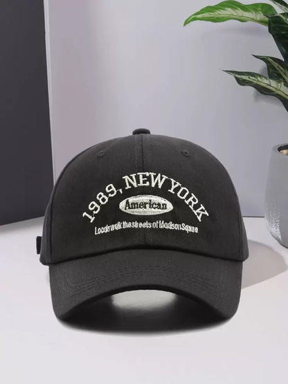 Black cap with '1989, New York' text on a light gray background in Pakistan by Caps Nation