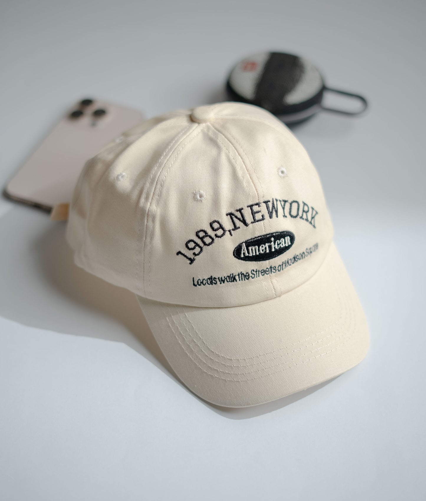 Beige cap with text on a light gray background in Pakistan by Caps Nation