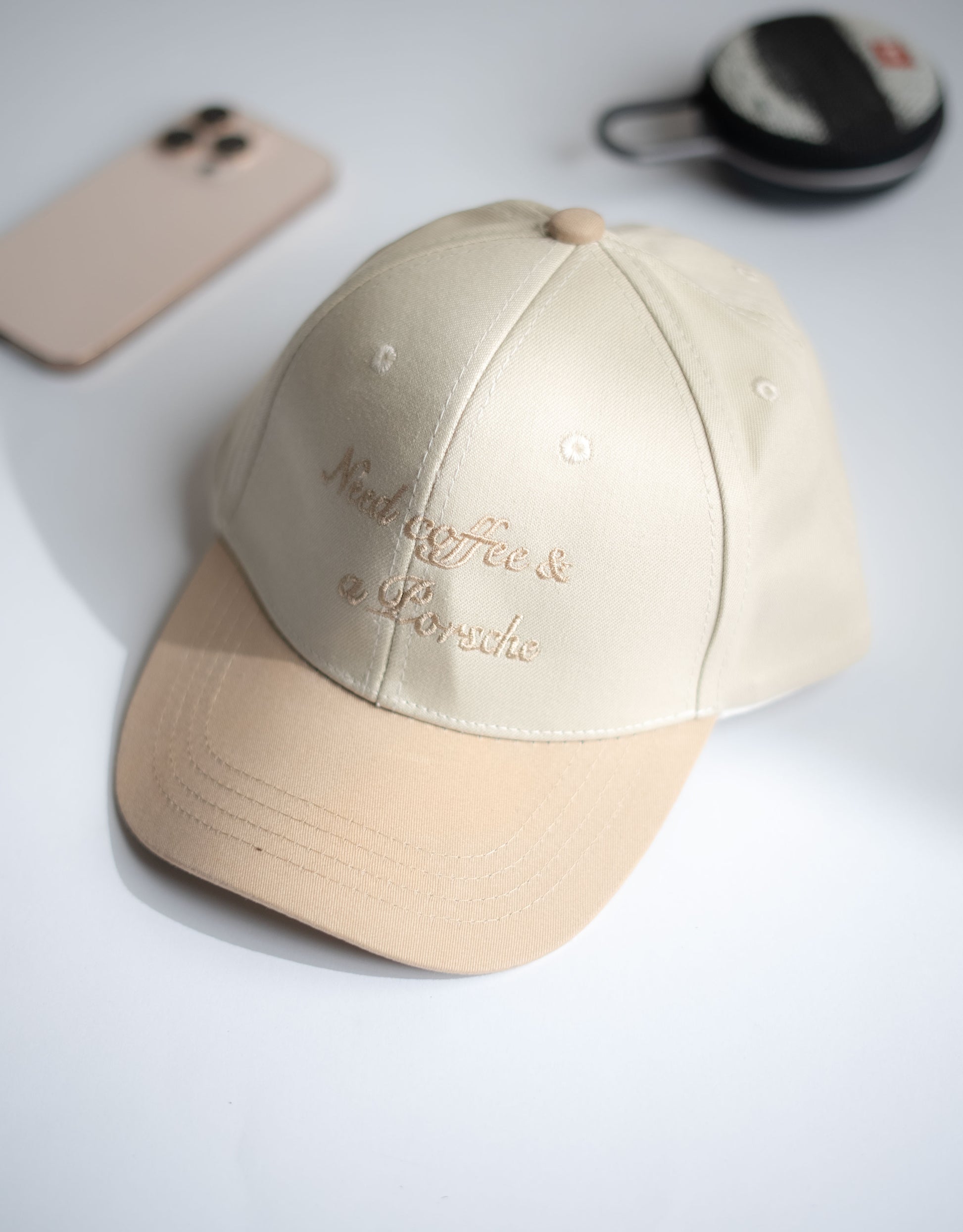Beige cap with text on a light gray surface in Pakistan by Caps Nation