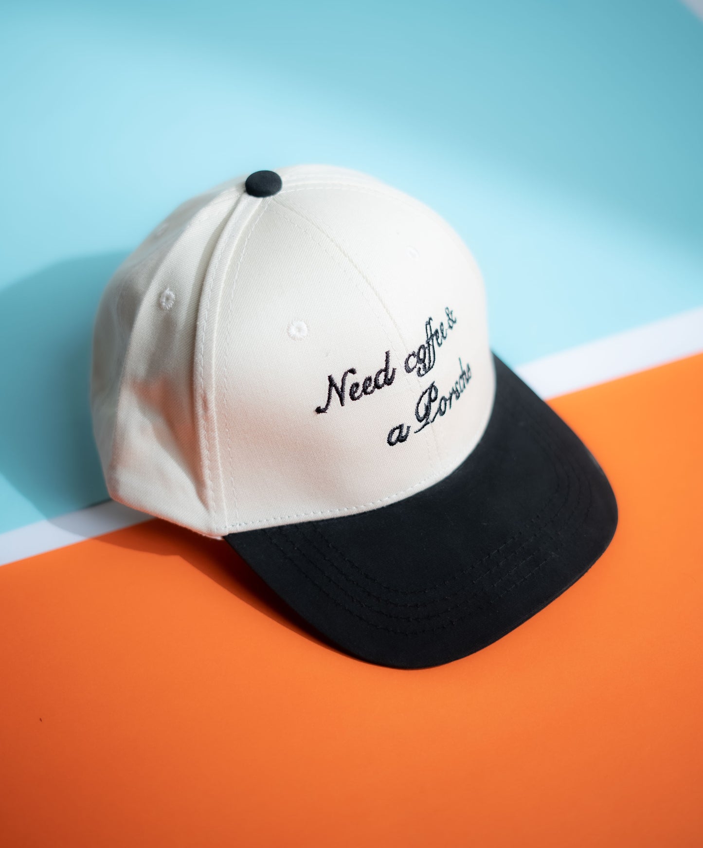 Cap with 'Need coffee & a pancake' text on a blue and orange  background in Pakistan by Caps Nation