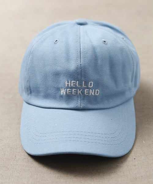 Light blue cap with 'HELLO WEEKEND' text on a beige background in Pakistan by Caps Nation