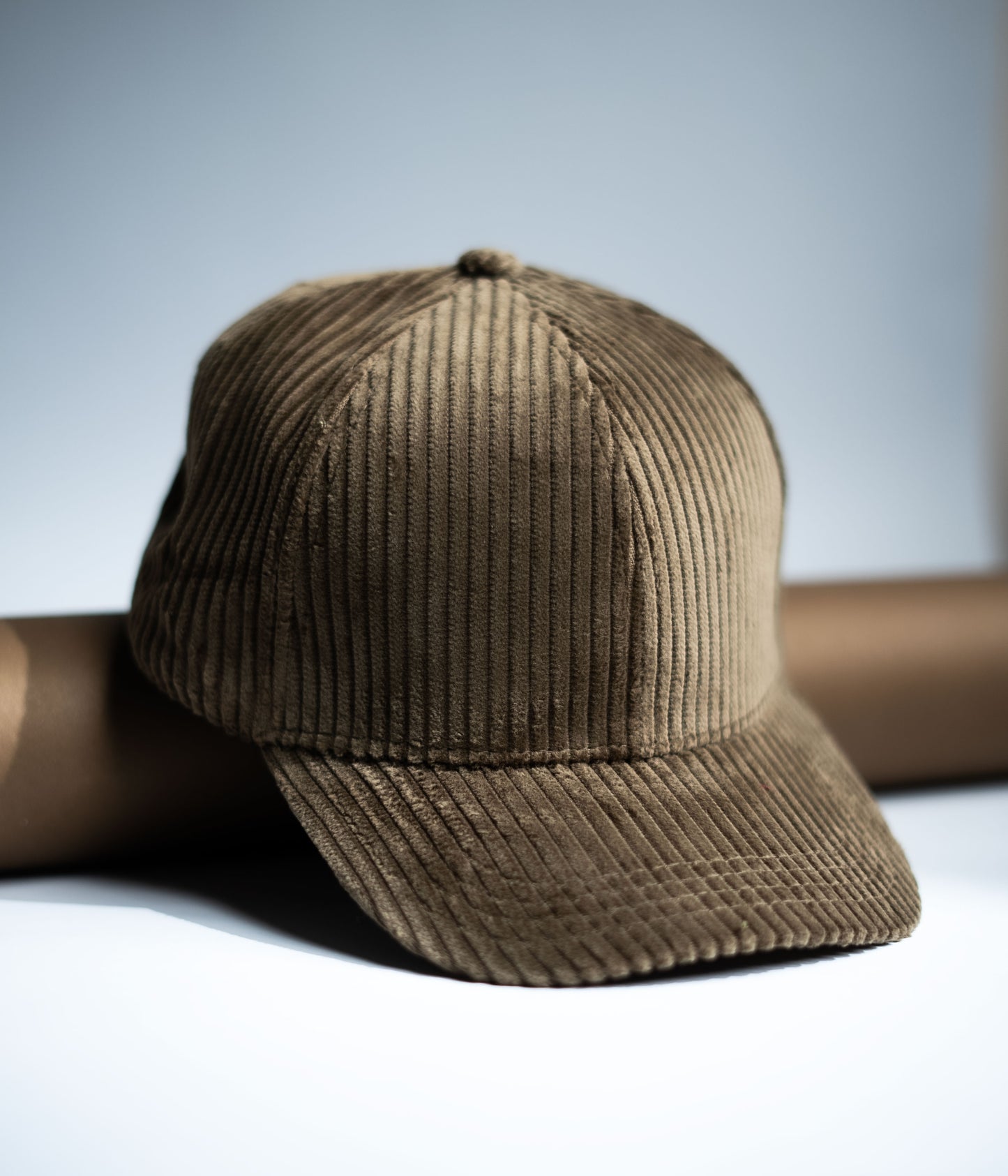 Brown corduroy cap on a light gray background in Pakistan by Caps Nation