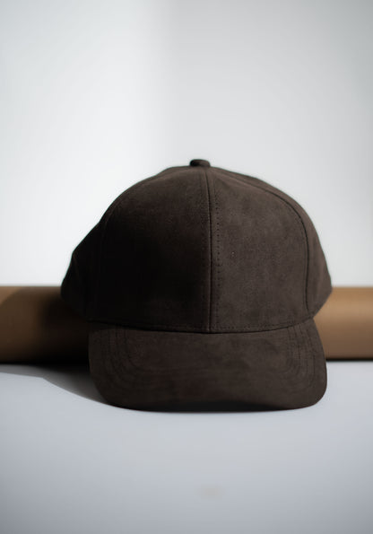 Brown suede cap on a white background in Pakistan by Caps Nation