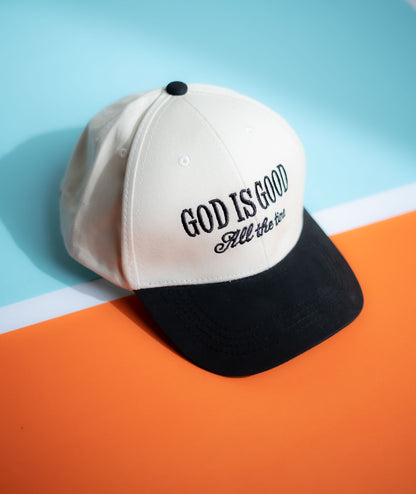 Cap with 'God is Good, All the Time' text on a blue and orange background in Pakistan by Caps Nation
