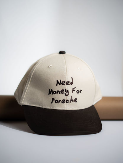 Beige and black cap with 'Need Money For Porsche' text on a light gray background in Pakistan by Caps Nation