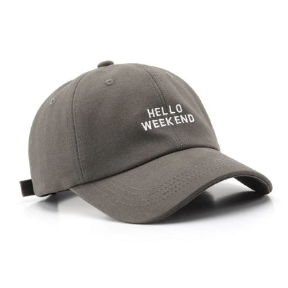 Gray cap with 'HELLO WEEKEND' text on a white background in Pakistan by Caps Nation