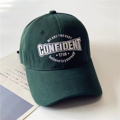 Green cap with motivational text on a light background in Pakistan by Caps Nation