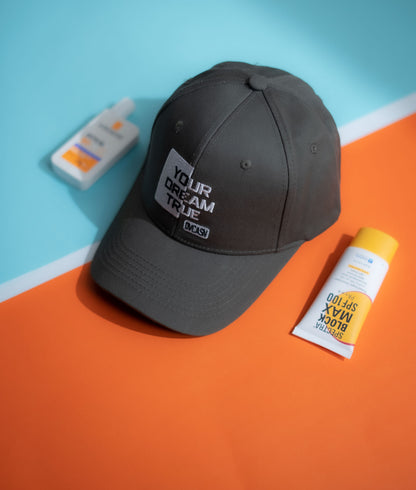 Gray cap with 'Your Dream True' text on a blue and orange background in Pakistan by Caps Nation