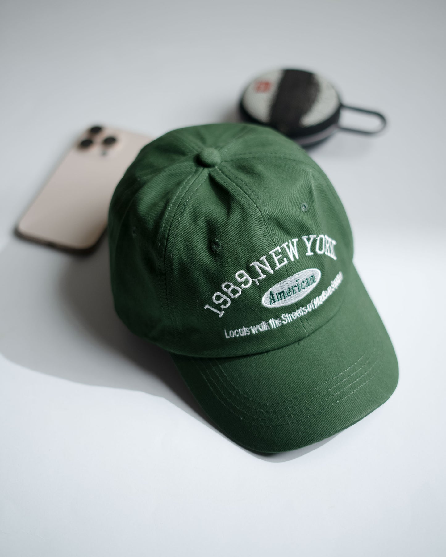 Green cap with text on a light gray background in Pakistan by Caps Nation