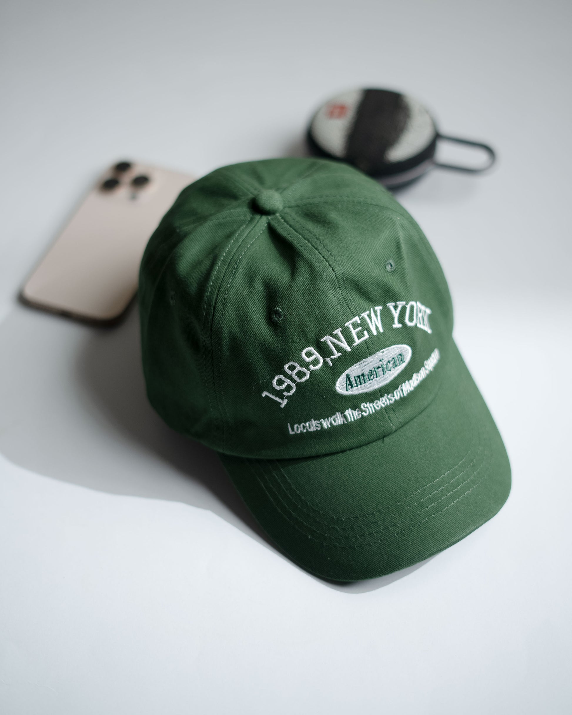 Green cap with text on a light gray background in Pakistan by Caps Nation