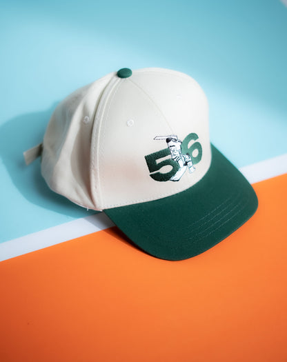 Baseball cap with number 56 and logo on a blue and orange background in Pakistan by Caps Nation