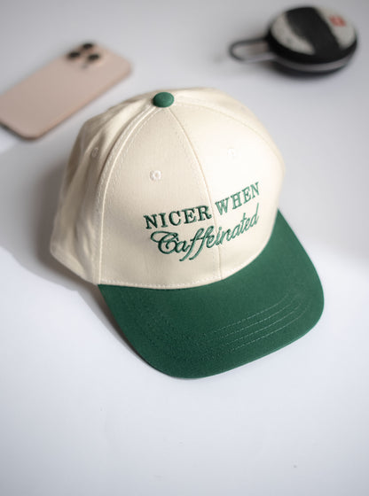 Beige and green cap with text on a white surface in Pakistan by Caps Nation