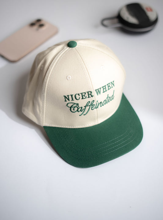 Beige and green cap with text on a white surface in Pakistan by Caps Nation