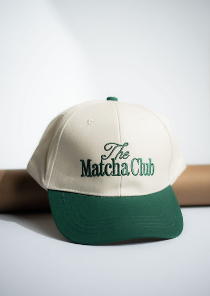 Beige and green cap with 'The Matcha Club' text on a white background in Pakistan by Caps Nation