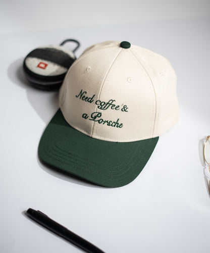 Cap with 'Need coffee & a Porsche' text on a neutral background in Pakistan by Caps Nation