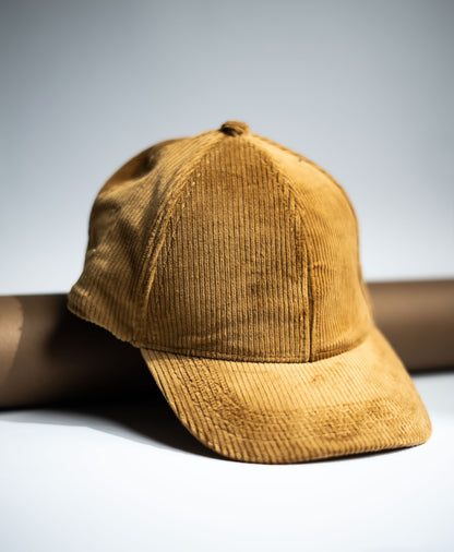 Brown corduroy cap on a light gray background in Pakistan by Caps Nation