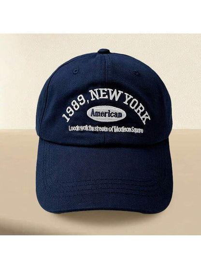 Navy blue cap with white text on a beige background in Pakistan by Caps Nation