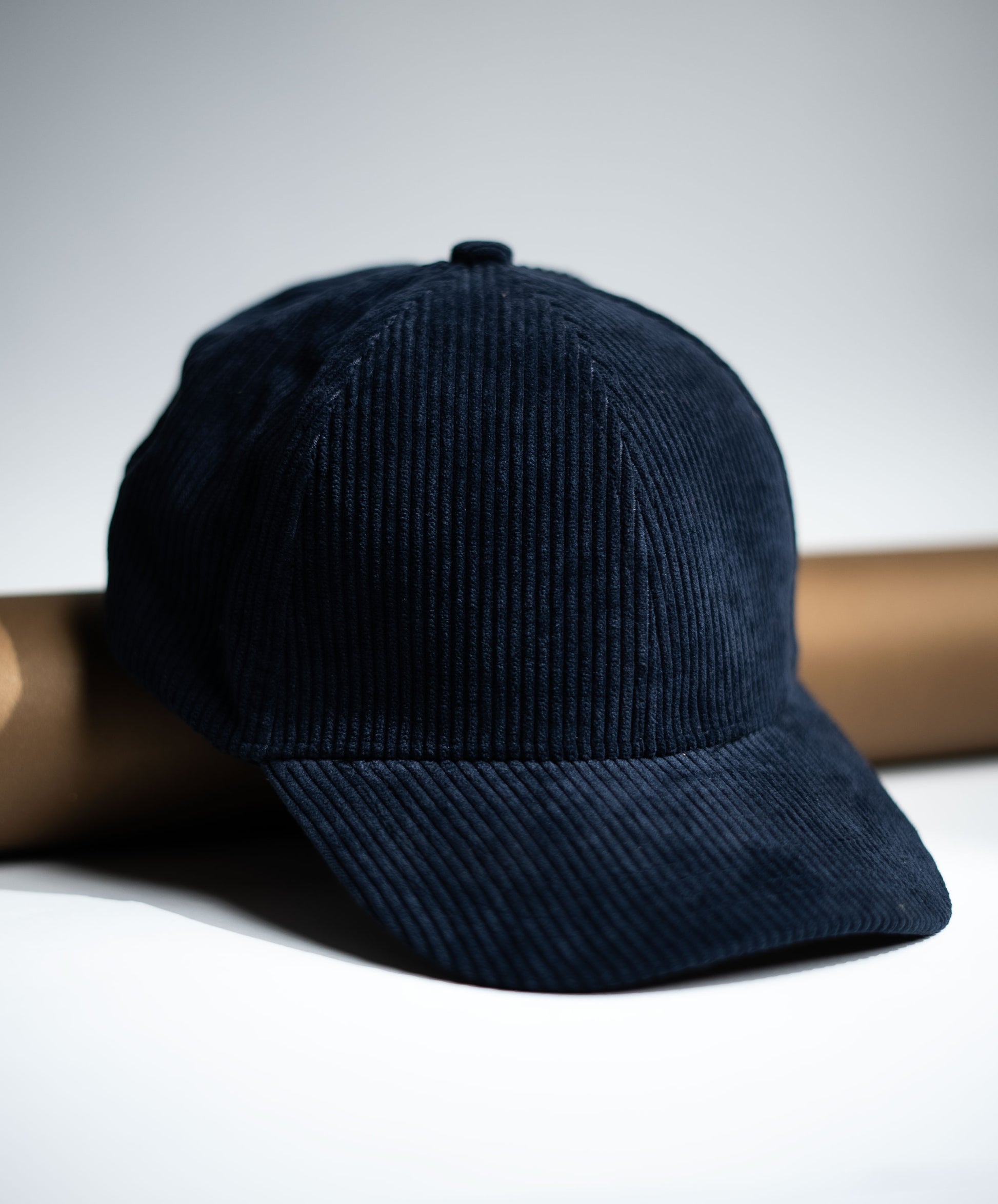 Navy blue corduroy cap on a light gray background in Pakistan by Caps Nation